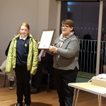 presenting prize to comp winner